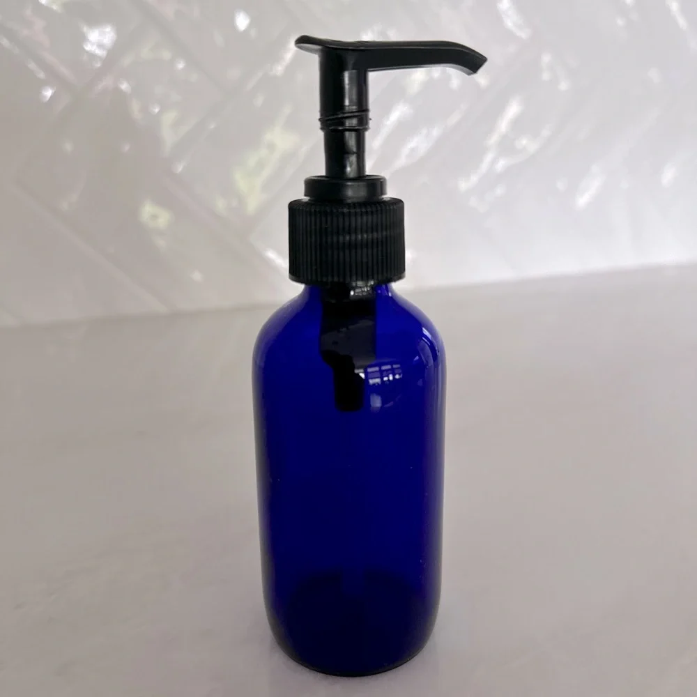 Cobalt blue glass lotion bottle